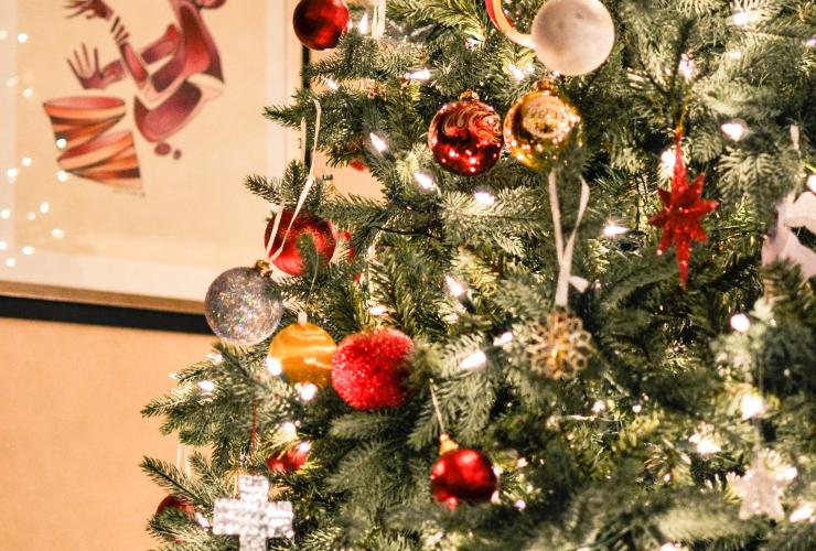 A Christmas tree with gold ornaments
