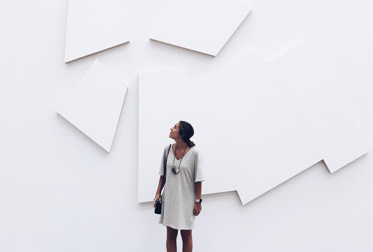 Check out the Yerba Buena Arts District woman in front of white museum wall